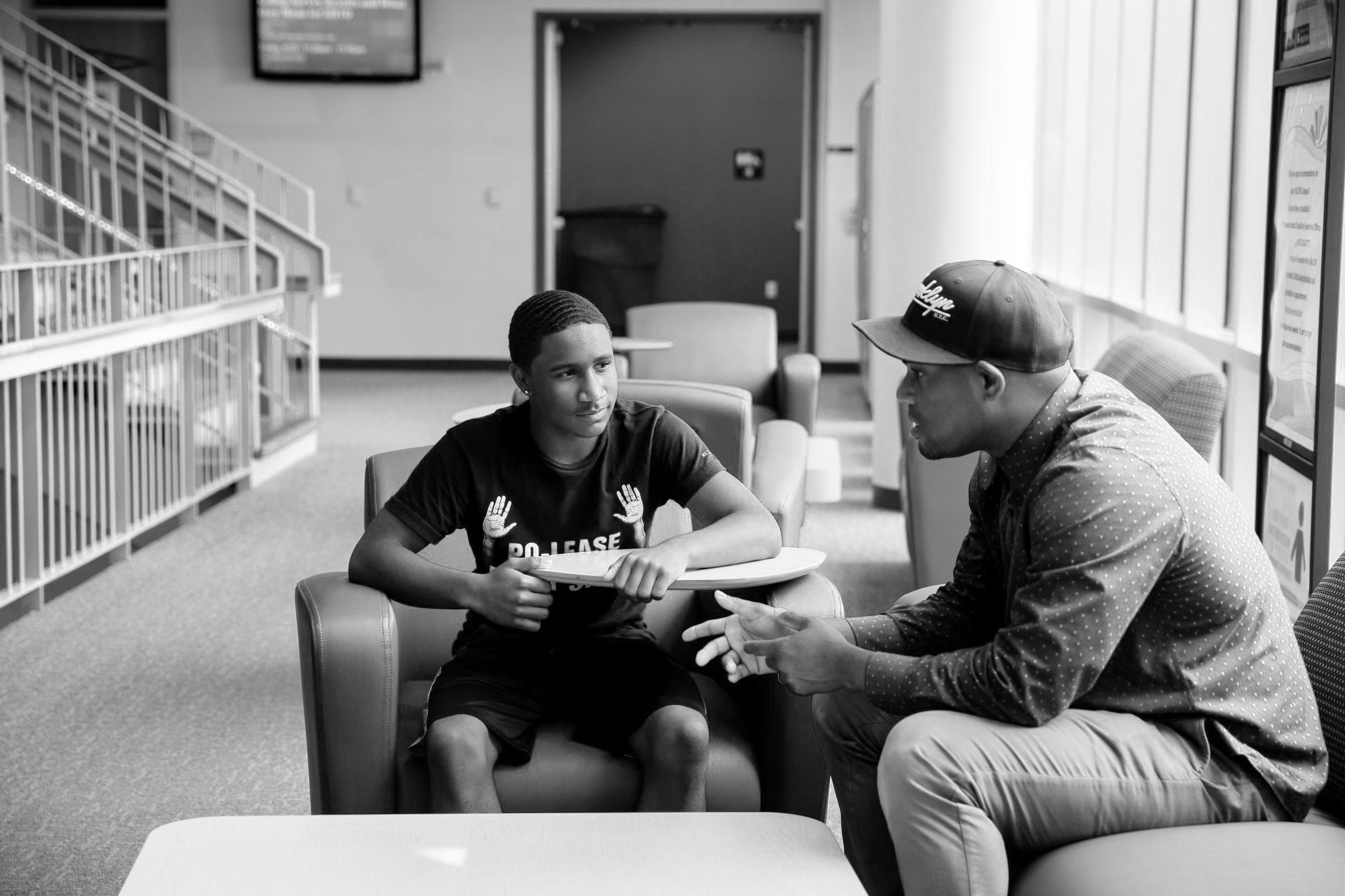 A Maiden Foundation mentor speaking with a young student